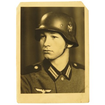 Studio portrait of the infanterist of the Wehrmacht in a helmet and  M36 tunic. Espenlaub militaria